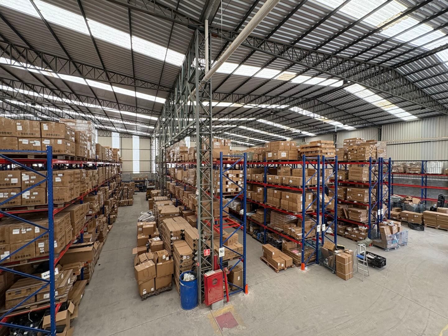 Wide view of organized stock in a warehousing facility